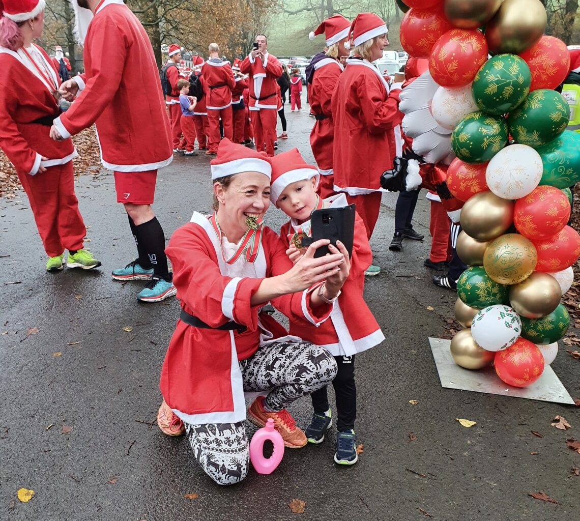 Mum and daughter in santa suits