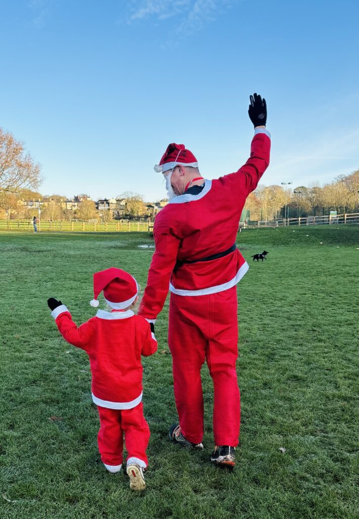 Father and son in santa suit