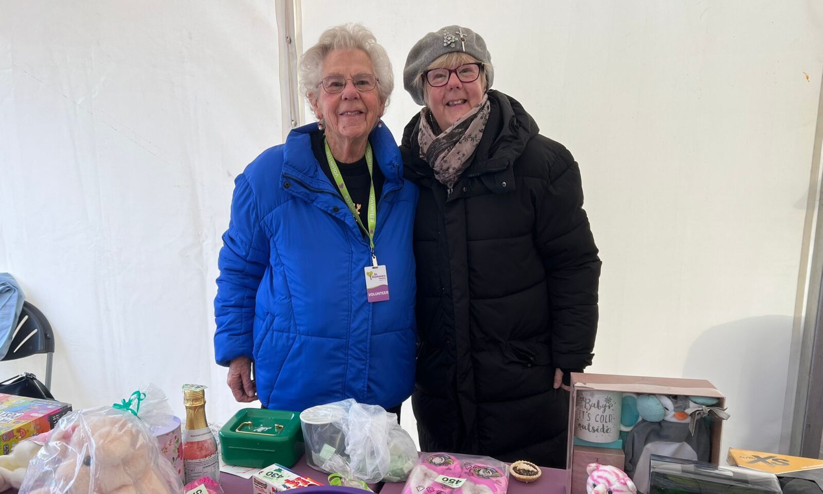 Two old ladies selling christmas gifts
