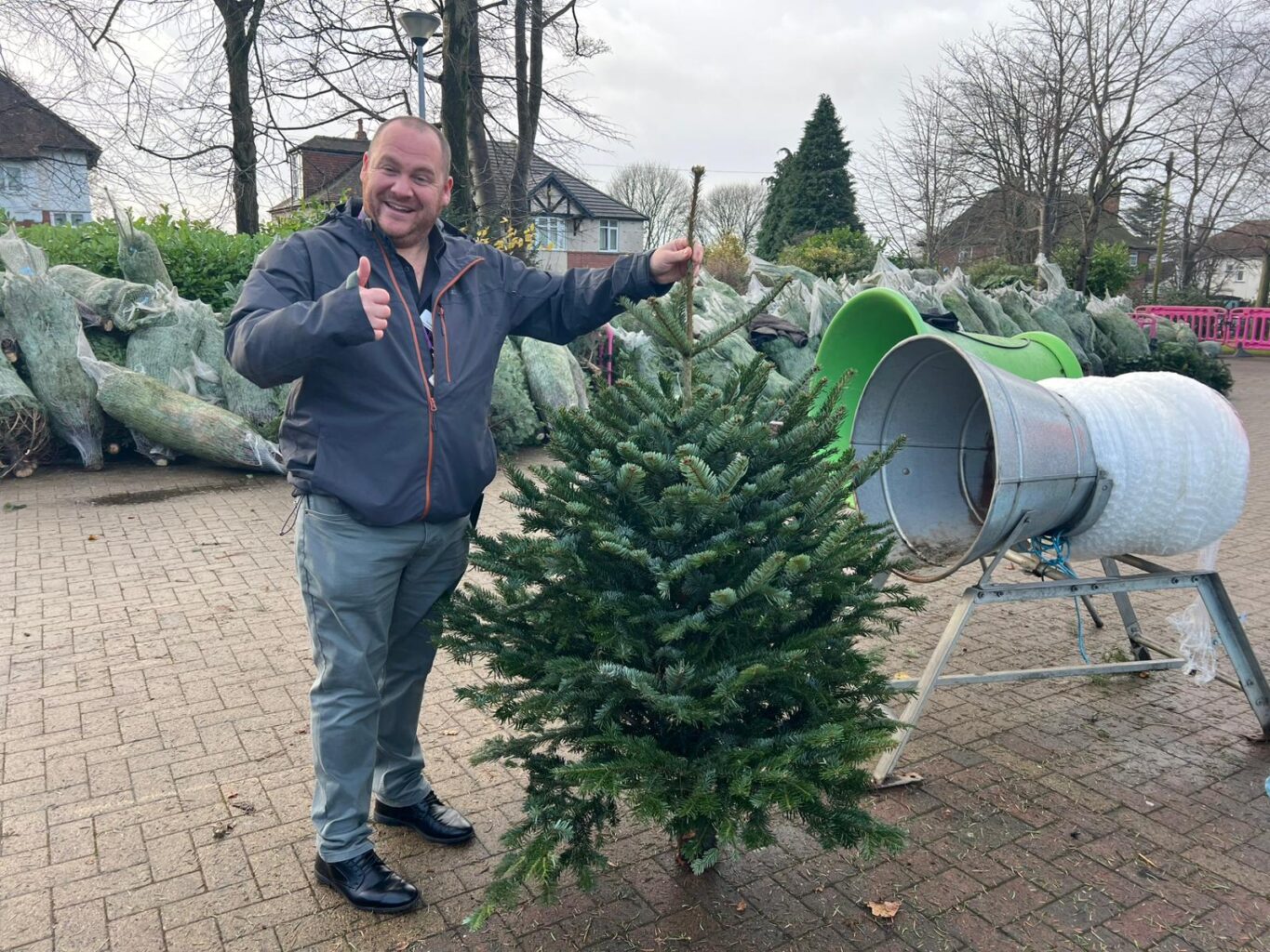 Man holding up his christmas tree