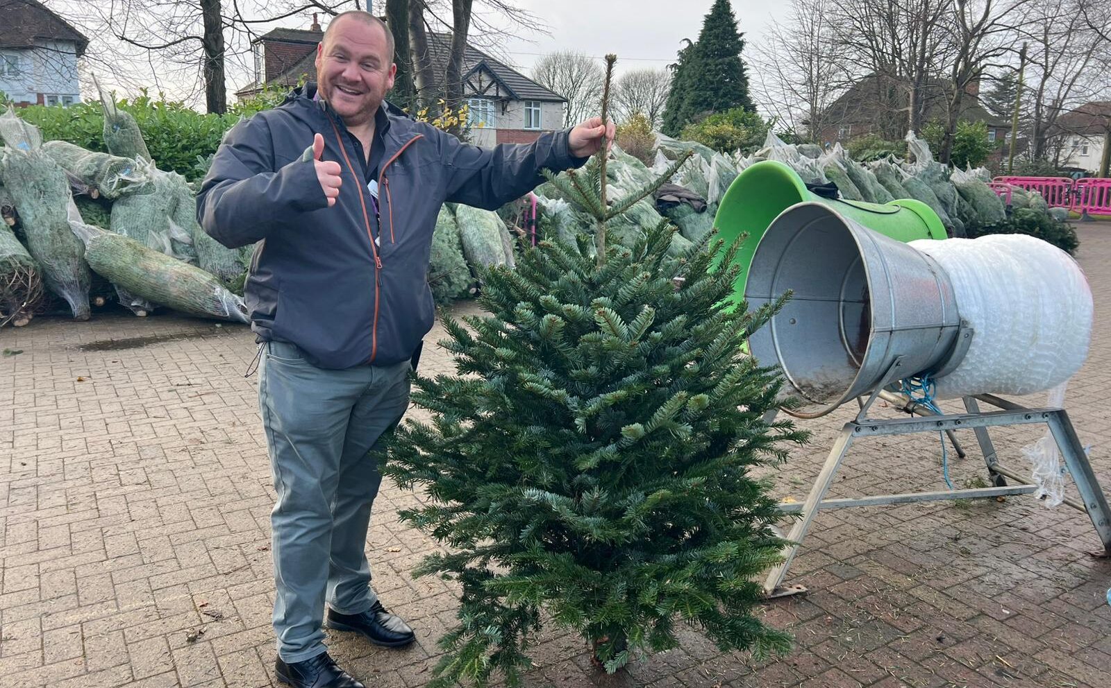 Man holding up his christmas tree