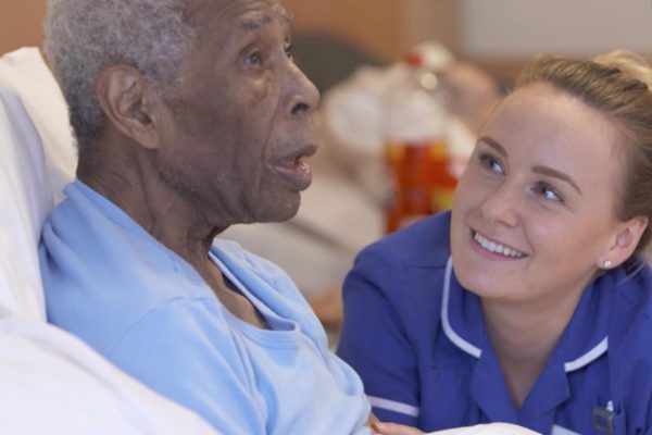 Smiling nurse with patient