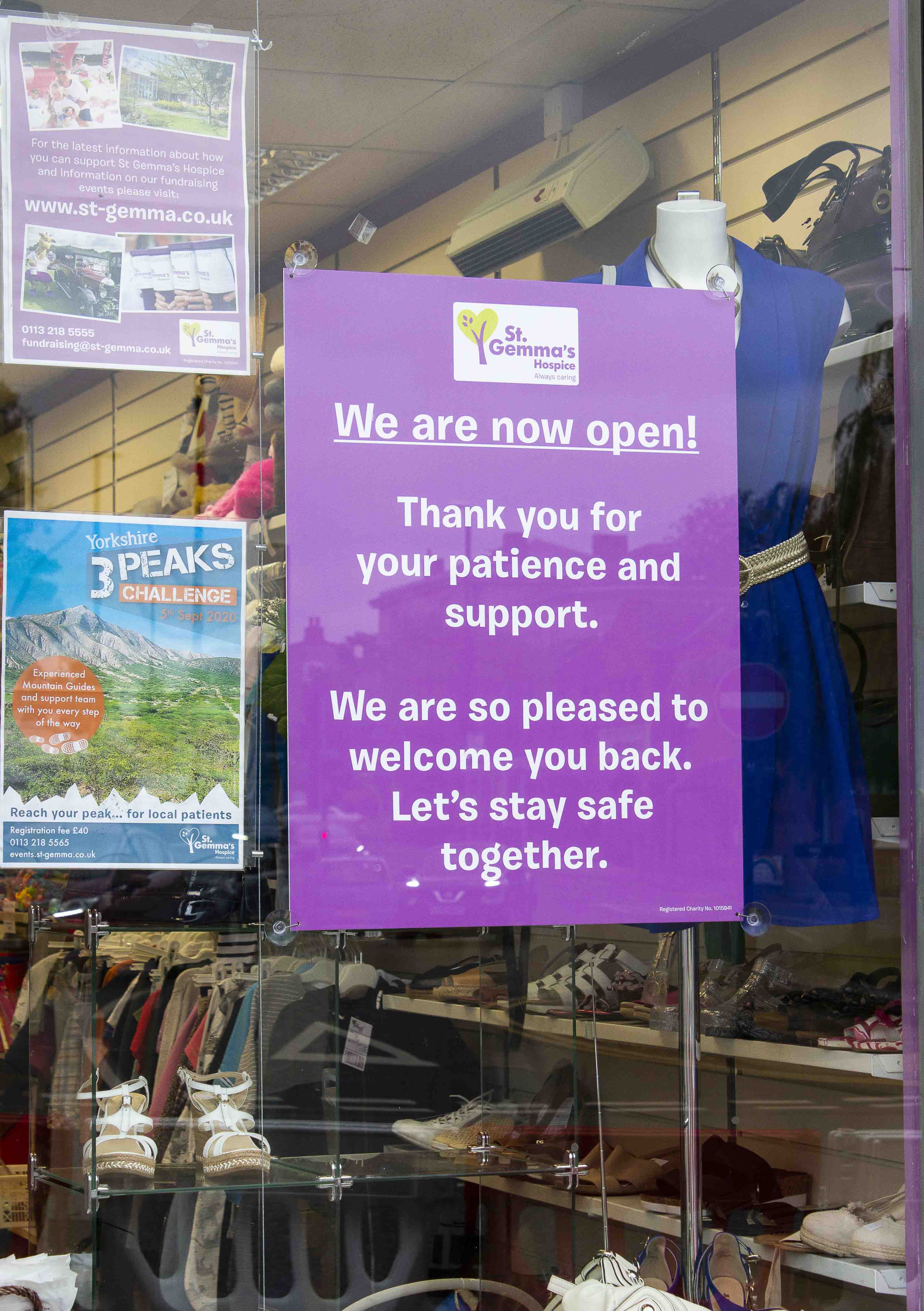 Welcome back poster in shop window